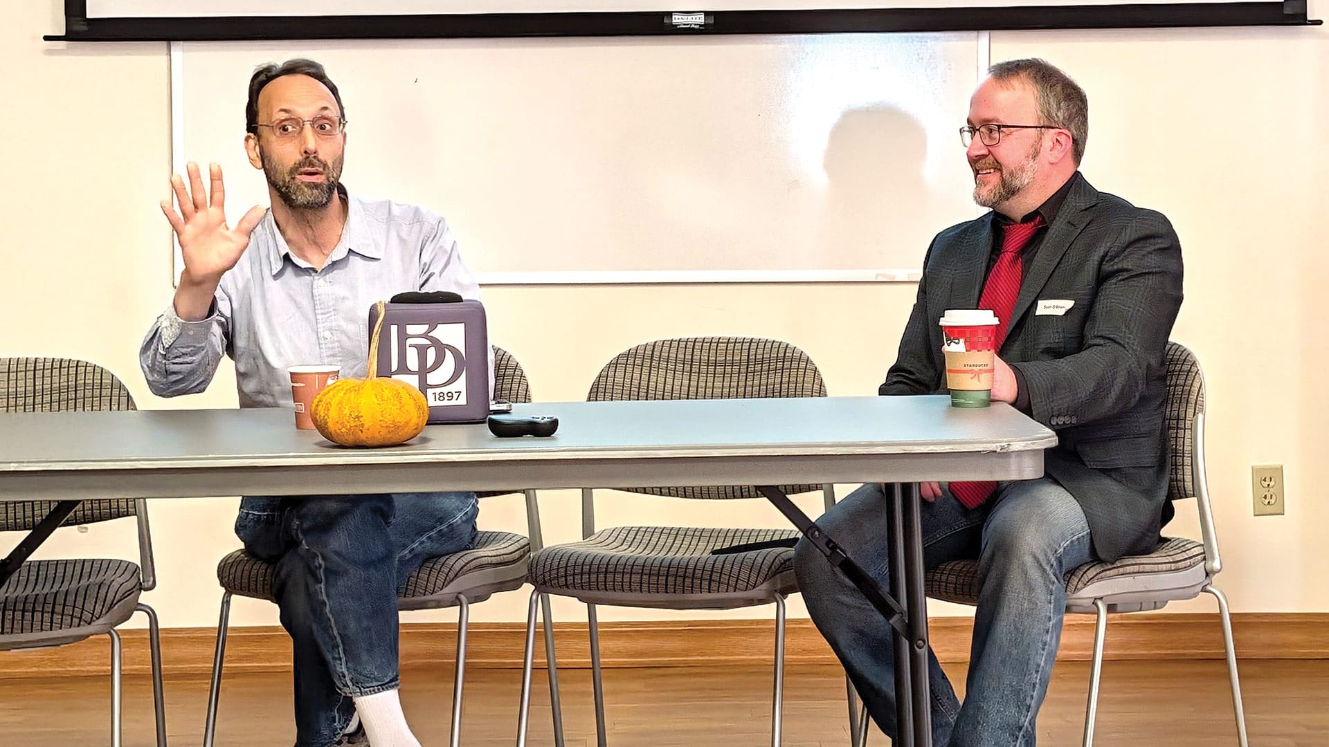 Sean O’Brien (right) conducts a ‘fireside chat’ with Yale Law School Professor Scott Shapiro about advances in cybersecurity and AI during the recent Cybersecurity Summit.