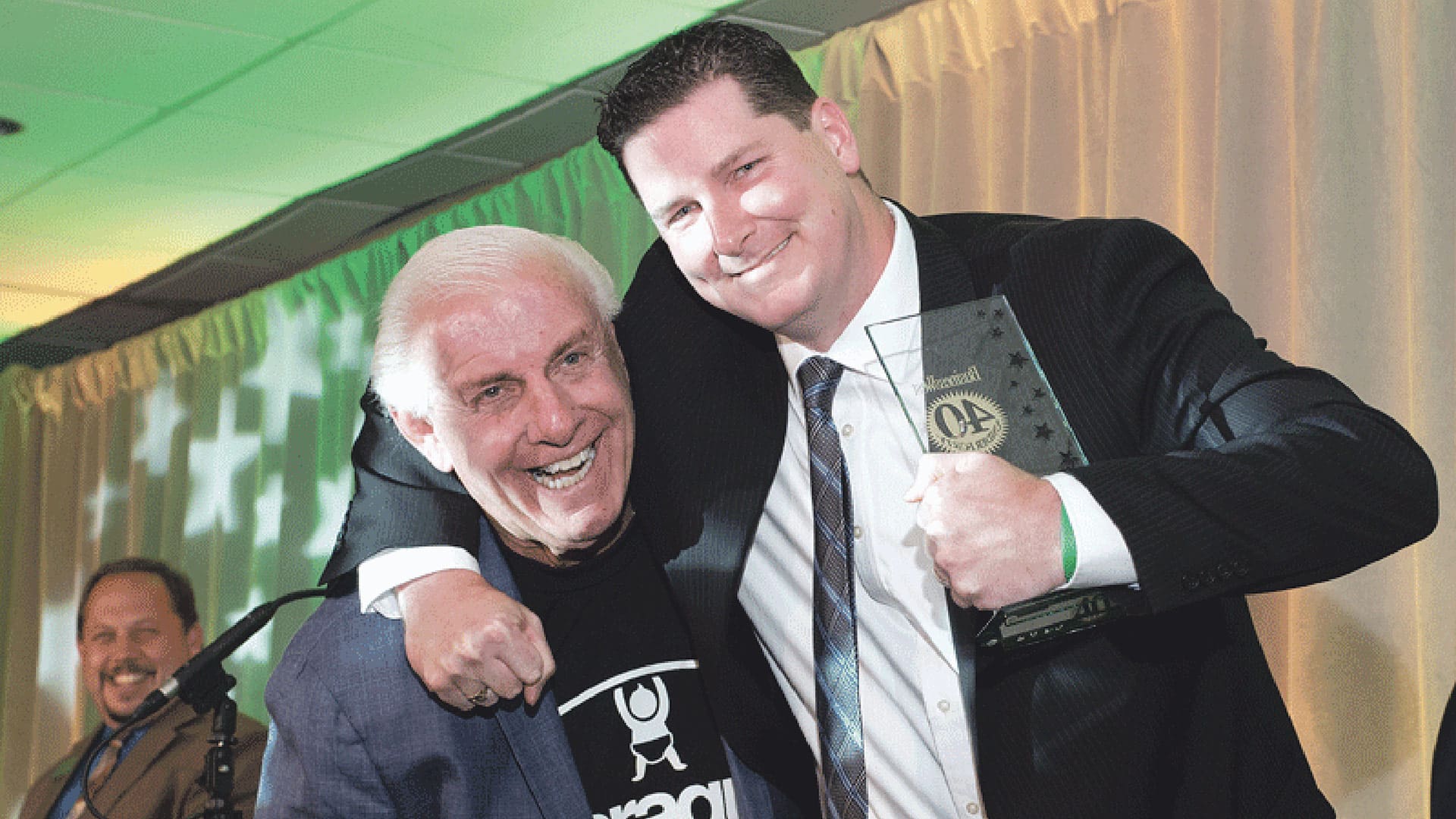 Wrestling icon Ric Flair was a special guest at the 40 Under Forty gala in 2015, pictured here meeting honoree Eric Devine, then Information Technology Services officer at Country Bank.File Photo