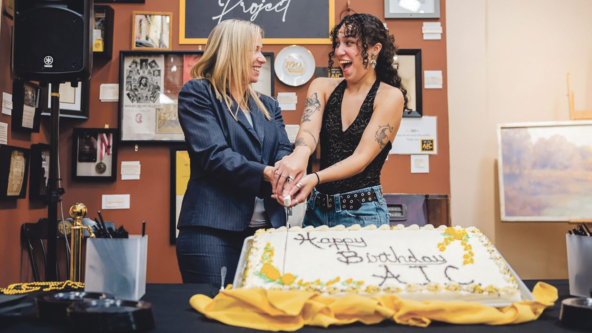 AIC President Nicolle Cestero (left), Student Government Assoc. President Ireland Stevenson (right), and others spoke as attendees wrote notes to future Yellow Jackets