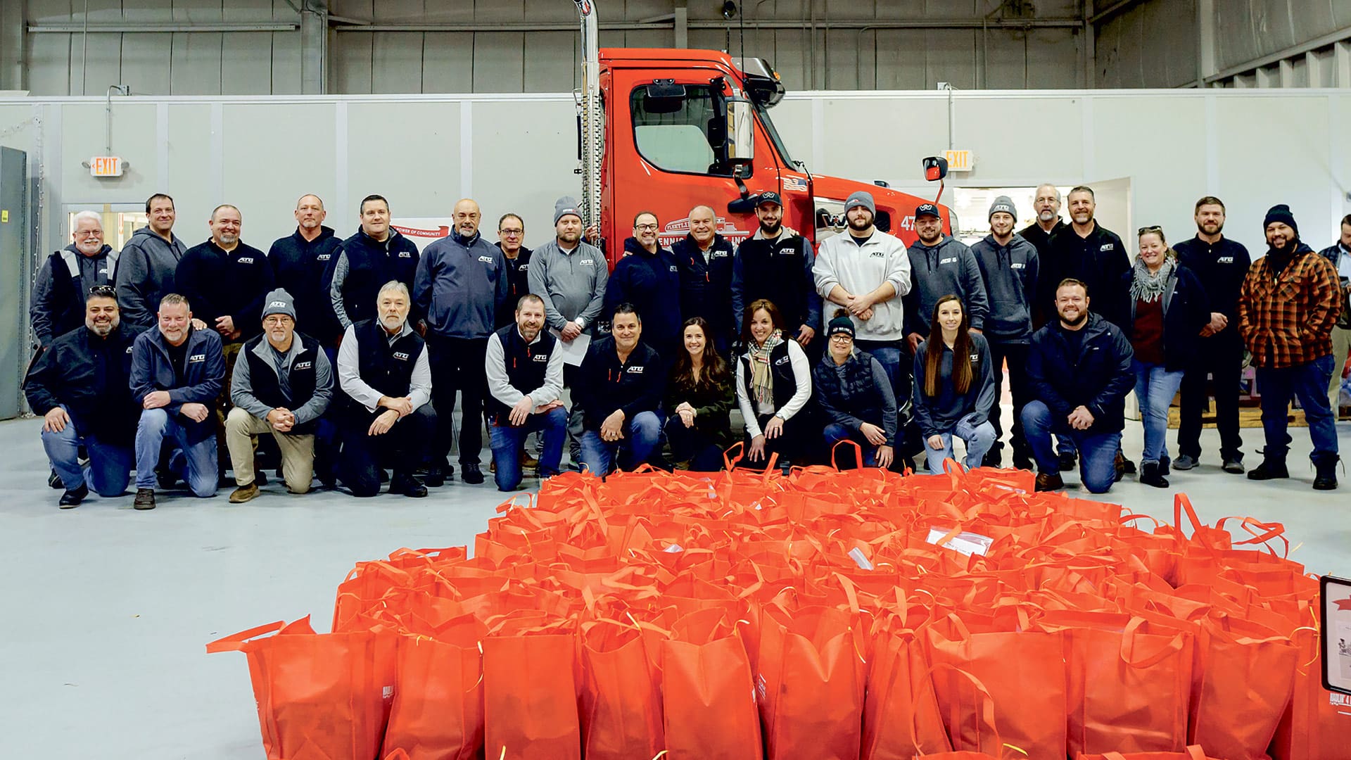 Employees from Advantage Truck Group in Westfield delivered non-perishable meals of canned chicken, ramen noodles, stuffing, canned peas, and cookies to Our Community Table Westfield Soup Kitchen