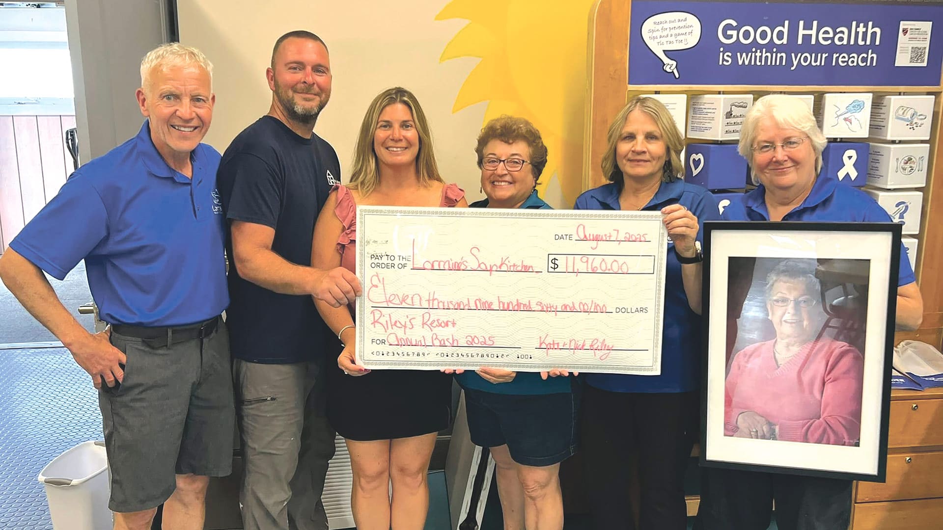 Pictured, from left: Nick Riley and Kate Riley (second and third from left) with, from left, Mike Dugre, Aida Gaouette, Kim Caisse, and Donna Marratta from Lorraine’s Soup Kitchen & Pantry.