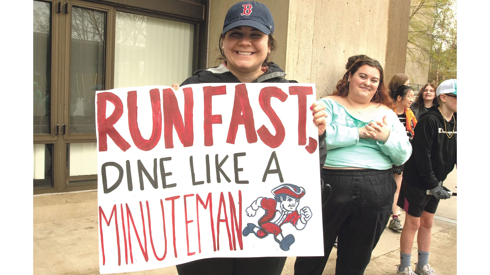 UMass students encourage runners along the 5K route.