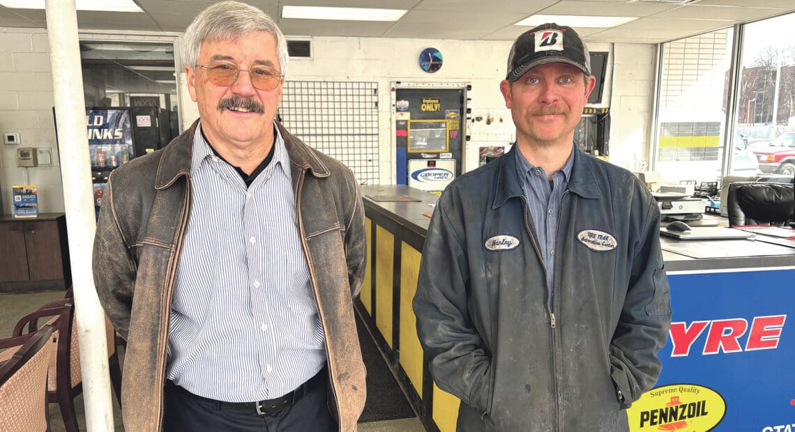 Peter Kearing, left, and Harley Andrew in the new home of Springfield Tyre Track and Auto Service.