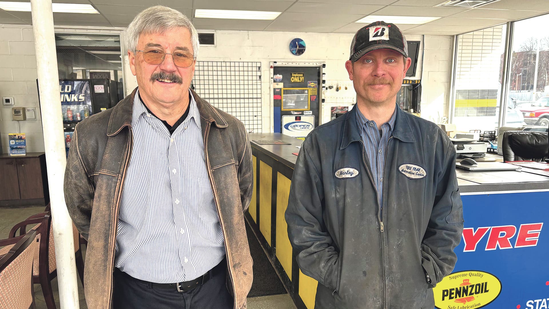 Peter Kearing, left, and Harley Andrew in the new home of Springfield Tyre Track and Auto Service.
