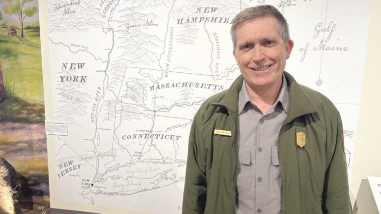 Alan Amelinckx stands by a map tracing the path of Col. Henry Knox’s Noble Train of Artillery.