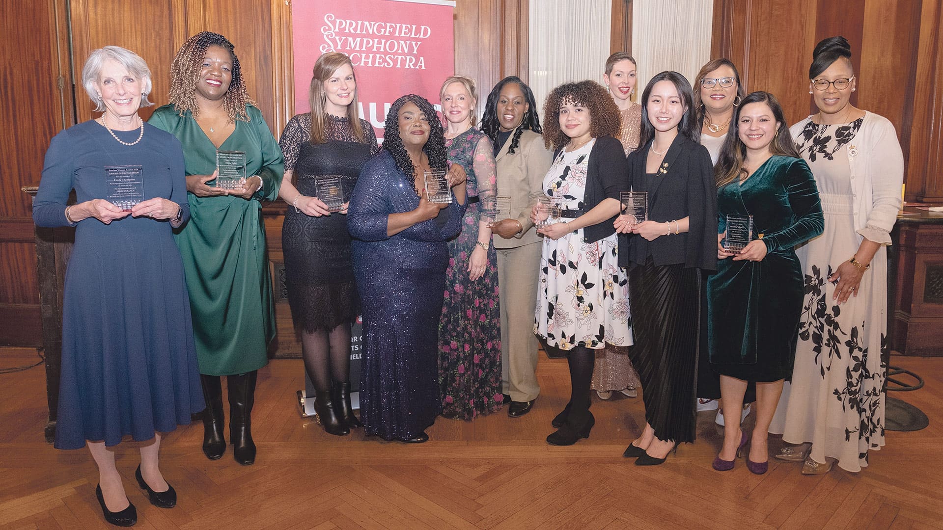 Pictured from left: Melina Phelps (accepting on behalf of Linda Thompson), Kisha Zullo, Megan Moynihan, Pat Ononibaku, SSO President and CEO Heather Caisse-Roberts, Terry Powe, Maeliz Colon, Erica Swallow, Rongbing Shen, Shannon Rudder, Claudia Quintero, and Ayanna Crawford.