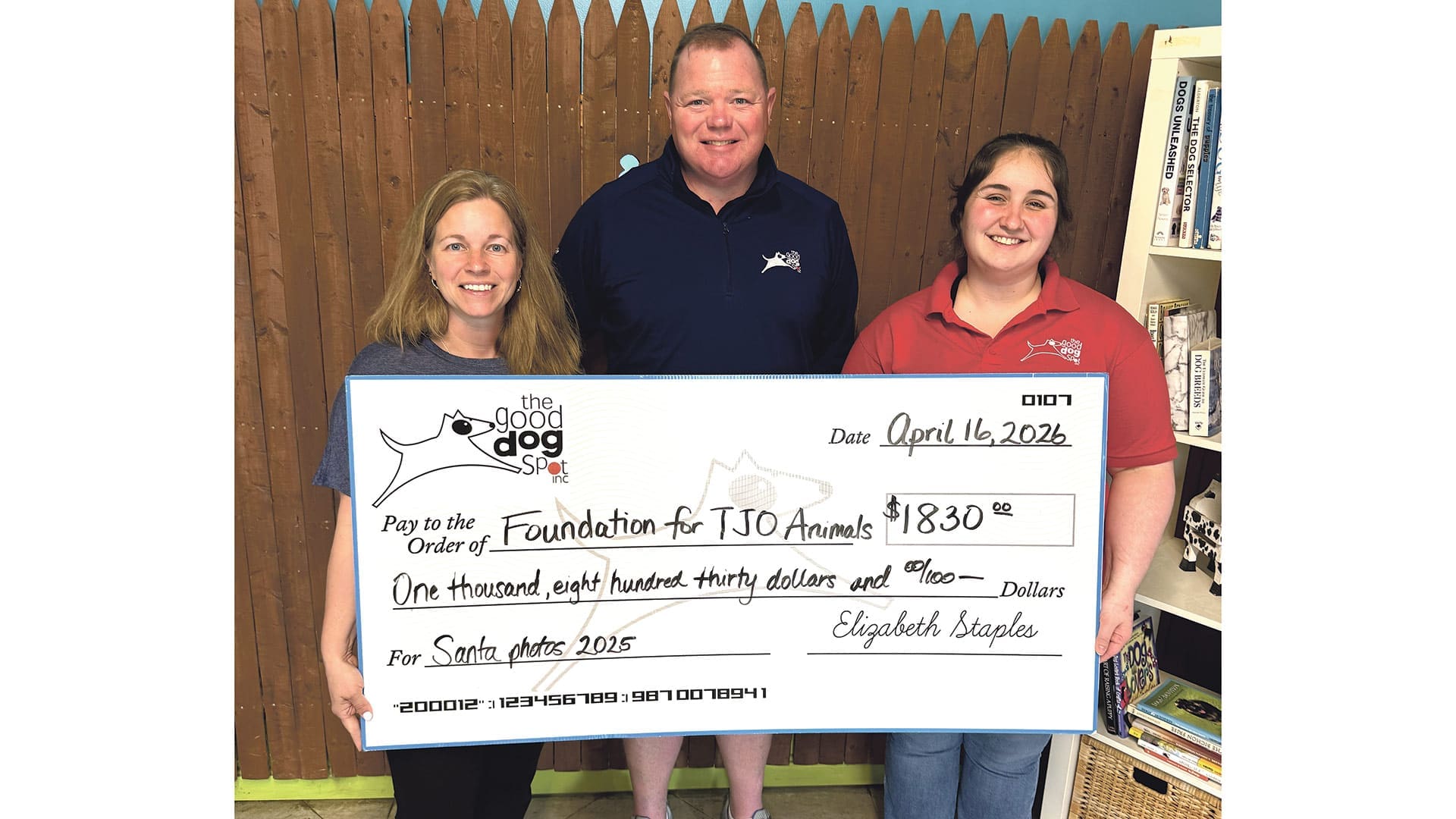 Pictured, from left: Elizabeth and Cory Staples, owners of the Good Dog Spot, alongside Facility Manager Shannon O’Connell, present the donation to the Foundation for TJO Animals.